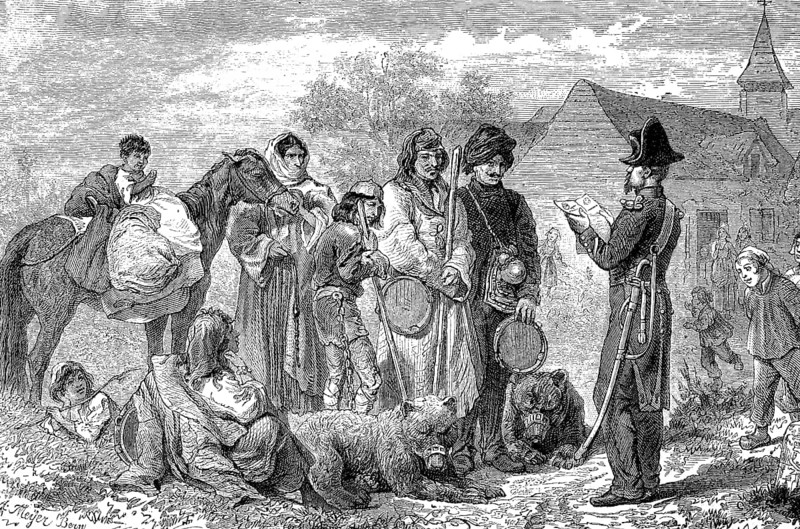 A group of gypsies is stopped and controlled by the village policeman