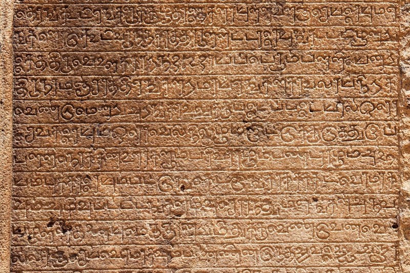 Ancient stone inscriptions in Singalese language texture Pollonaruwa