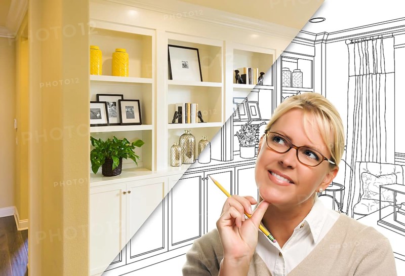 Young woman over custom built-in shelves and cabinets design drawing to cross section of finished photo