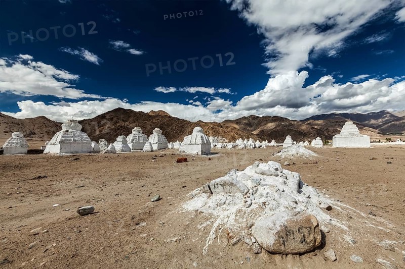 Whitewashed Buddhist chortens Tibetan Buddhist stupas