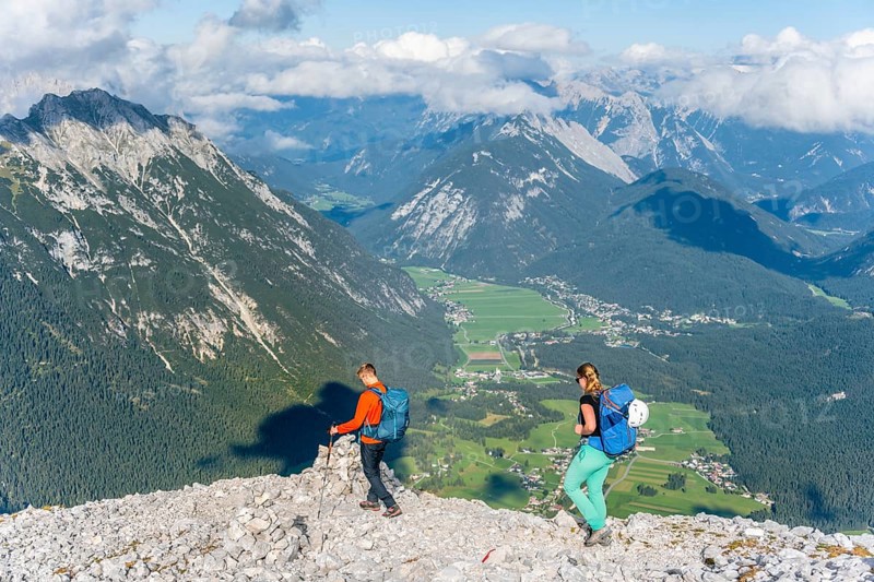 Hiker in front of mountain landscape