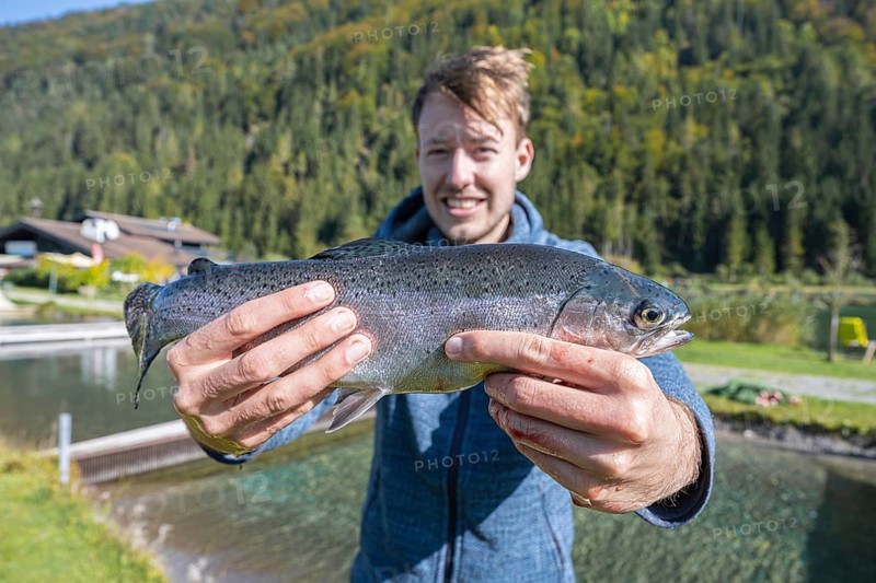 Man holding caught trout