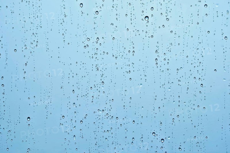 Rain water drops droplets on window glass texture background