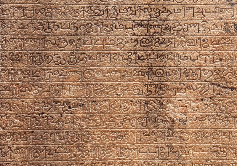 Ancient stone inscriptions in Singalese language texture Pollonaruwa