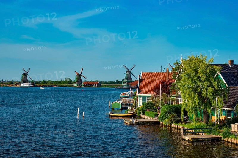 Netherlands rural lanscape Windmills at famous tourist site Zaanse Schans in Holland Zaandam