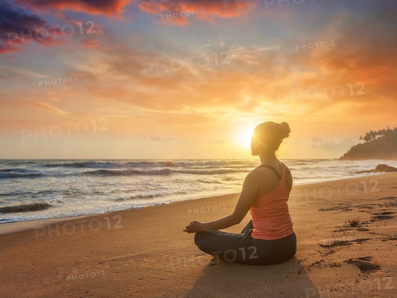 Young sporty fit woman doing yoga
