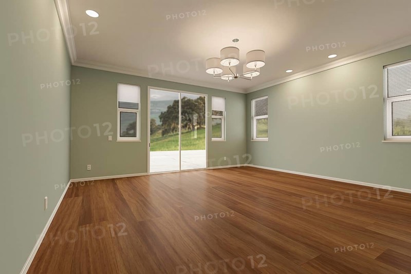 Newly remodeled room of house with finished wood floors