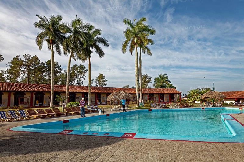 Man cleaning swimming pool