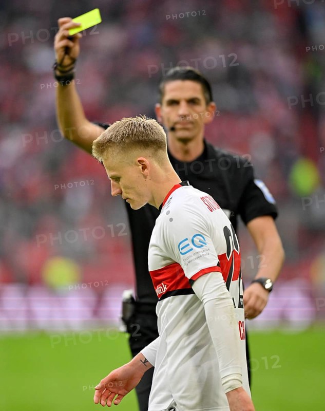 Referee Deniz Aytekin shows yellow card to Chris Fuehrich VfB Stuttgart