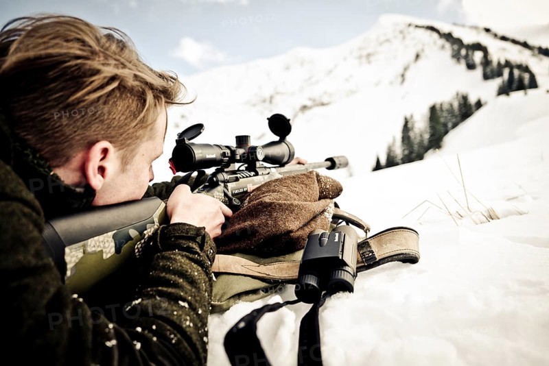 Hunter prepares to shoot. Mountain hunting Karwendel Mountains