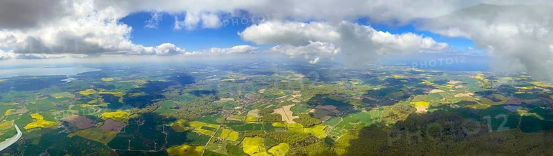 Panoramic view from a glider between the Baltic Sea and Lake Ploen. On the left the plane surface and Lake Ploen