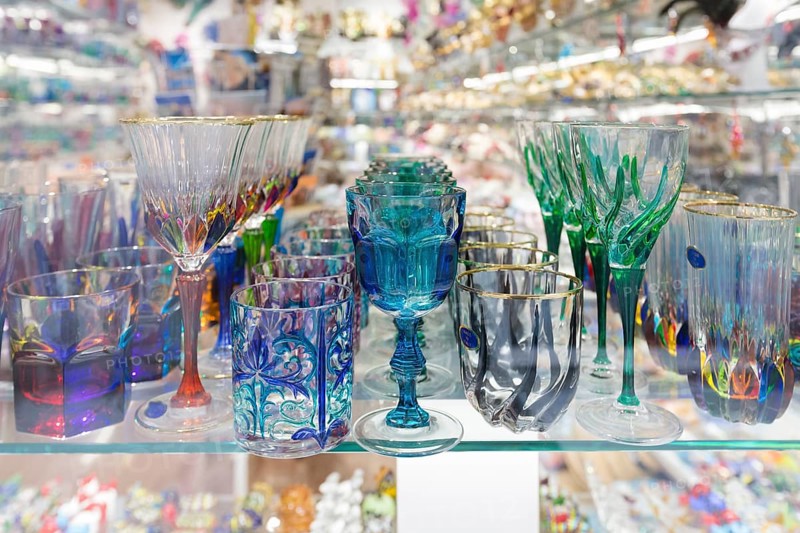 Colourful drinking glasses made in Murano on display in a shop in Venice