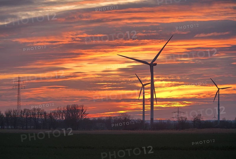 Wind turbines and power line in the evening. Wind turbines in the Hamburg Vier- und Marschlanden