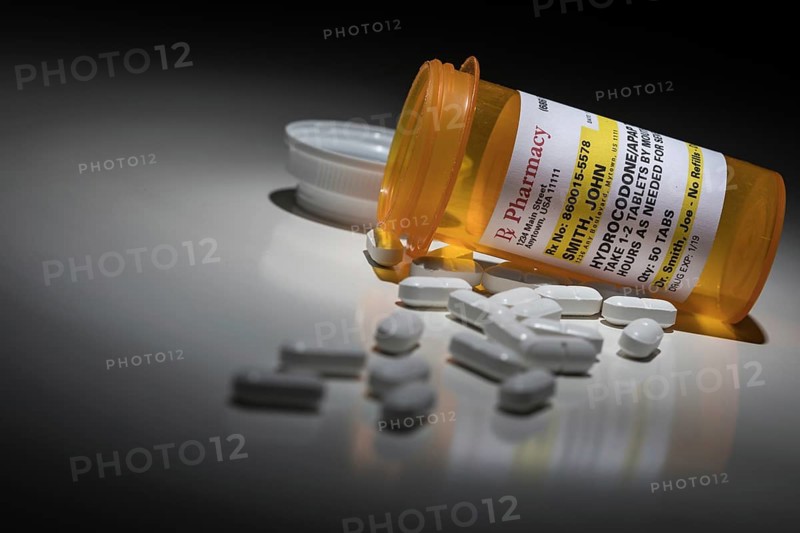 Hydrocodone pills and prescription bottle with non proprietary label. no model release required