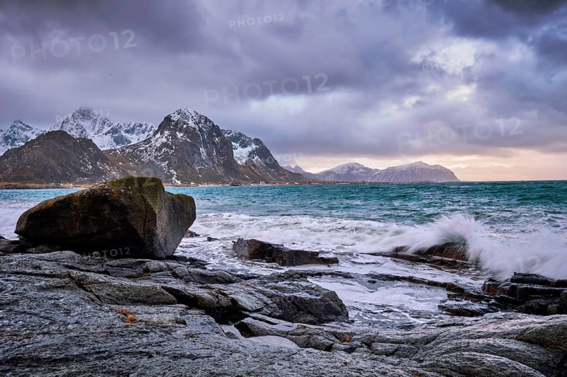 Rocky coast of fjord of Norwegian sea in winter. Vareid