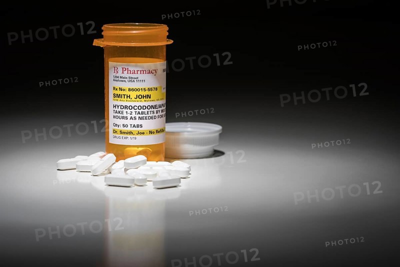 Hydrocodone pills and prescription bottle with non proprietary label. no model release required