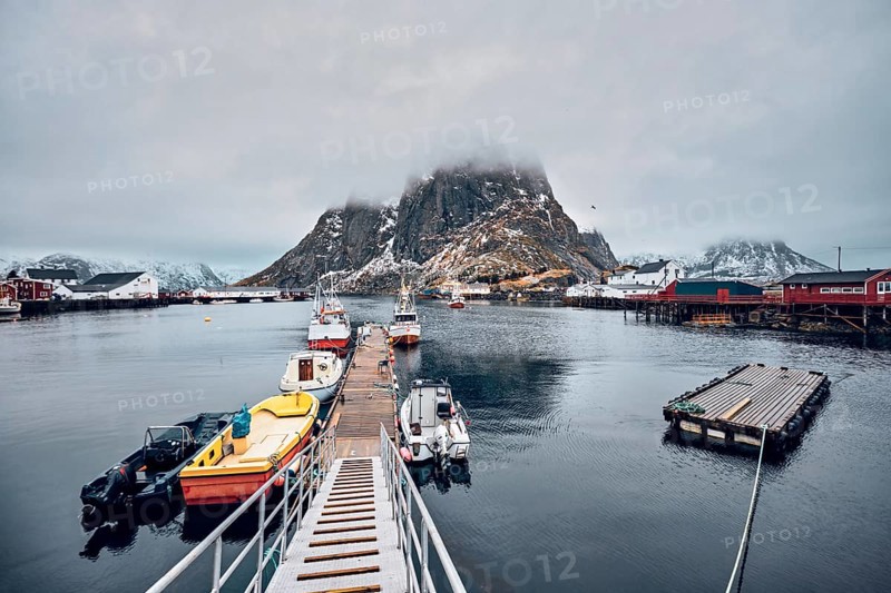 Pier with ships in Hamnoy fishing village on Lofoten Islands
