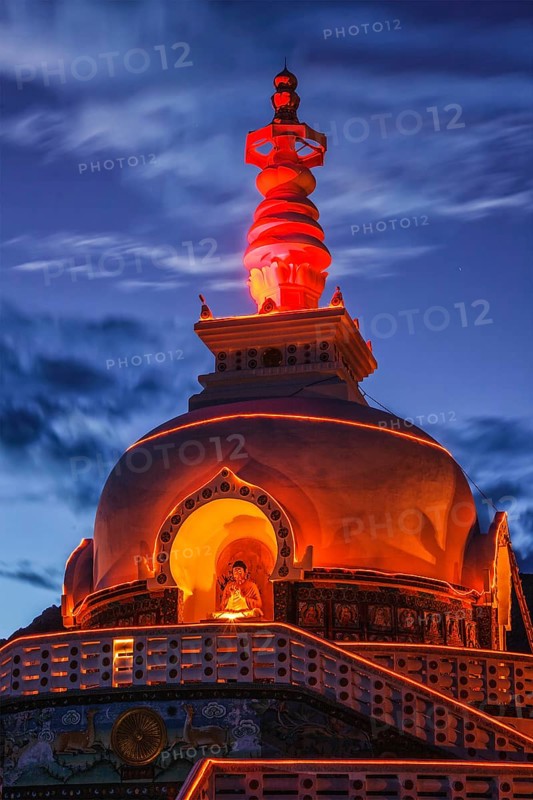 Shanti stupa illuminated in the evening twilight. Leh