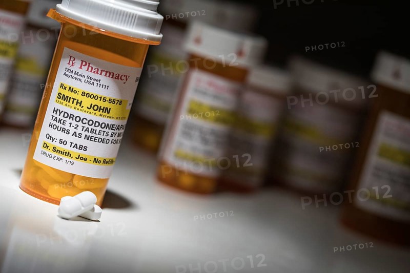 Hydrocodone pills and prescription bottles with non proprietary label. no model release required