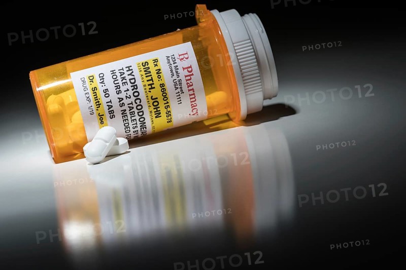 Hydrocodone pills and prescription bottle with non proprietary label. no model release required