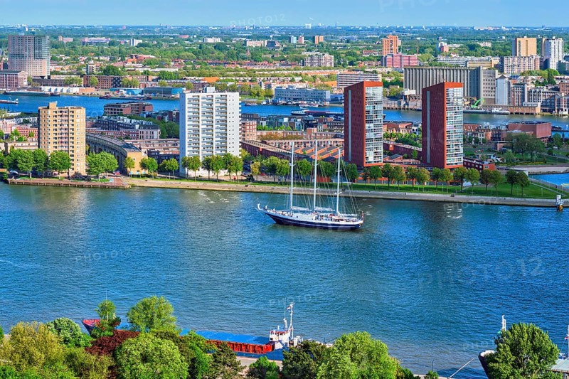 View of Rotterdam city and Nieuwe Maas river with sailing vessel from Euromast