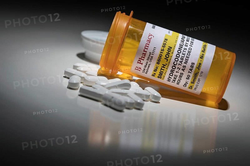 Hydrocodone pills and prescription bottle with non proprietary label. no model release required