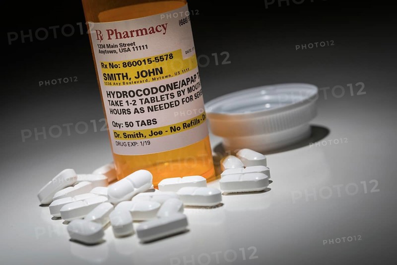 Hydrocodone pills and prescription bottle with non proprietary label. no model release required