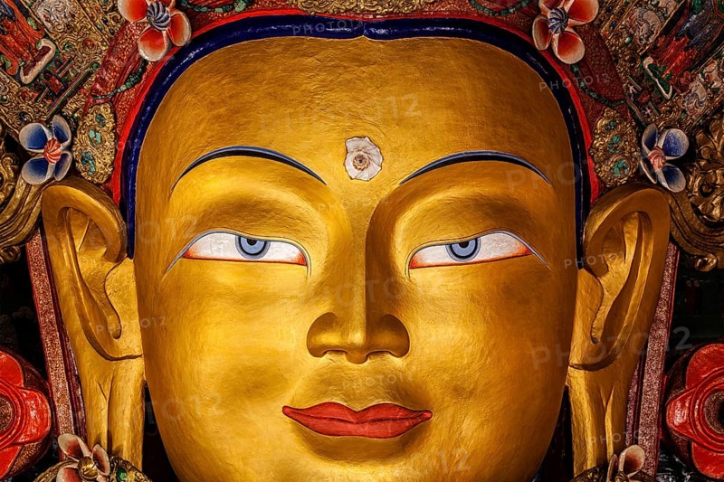 Maitreya Buddha statue face close up in Thiksey Gompa. Ladakh