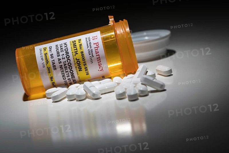 Hydrocodone pills and prescription bottle with non proprietary label. no model release required