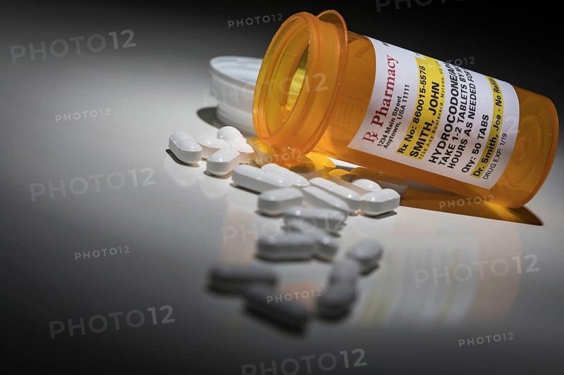 Hydrocodone pills and prescription bottle with non proprietary label. no model release required
