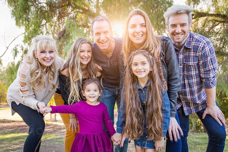 Multigenerational mixed-race family portrait outdoors