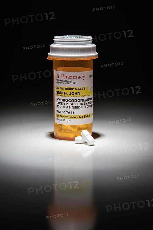 Hydrocodone pills and prescription bottle with non proprietary label. no model release required
