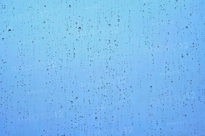 Rain water drops droplets on window glass texture background
