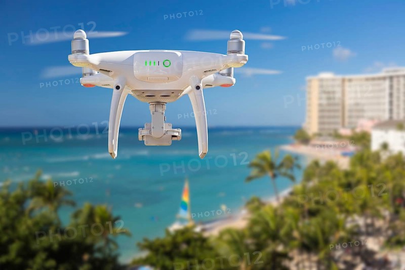 Drone flying above waikiki beach in hawaii