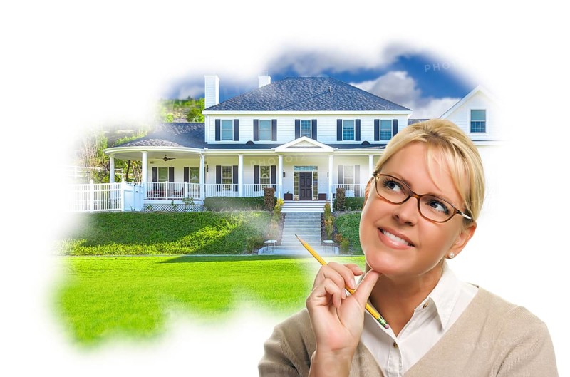 Daydreaming woman with pencil over custom house photo in thought bubble