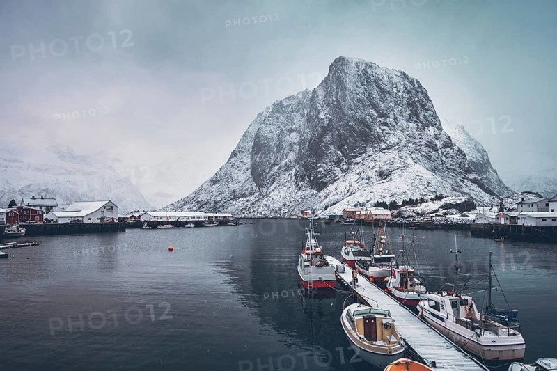 Pier with ships in Hamnoy fishing village on Lofoten Islands