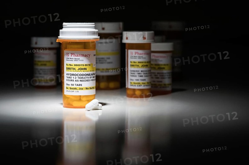 Hydrocodone pills and prescription bottles with non proprietary label. no model release required