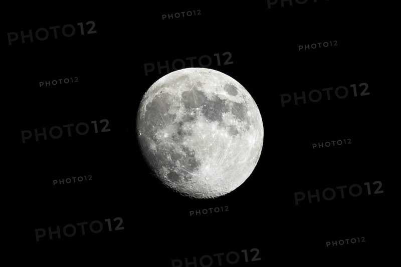 Almost full moon against A black sky shot from southern California