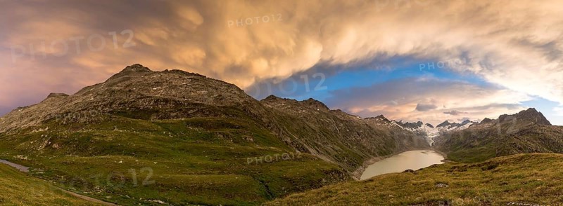 Stormy atmosphere over Lake Oberaar and the Bernese Alps