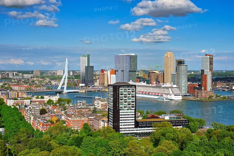 View of Rotterdam city and the Erasmus bridge Erasmusbrug over Nieuwe Maas river with cruise liner from Euromast