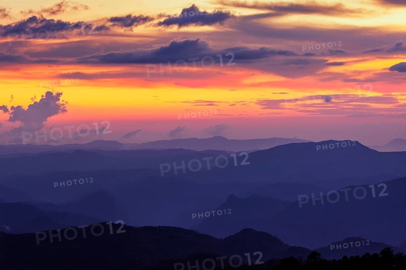 Silhouettes of hills in valley on sunset. Pothamedu viewpoint