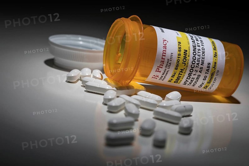 Hydrocodone pills and prescription bottle with non proprietary label. no model release required