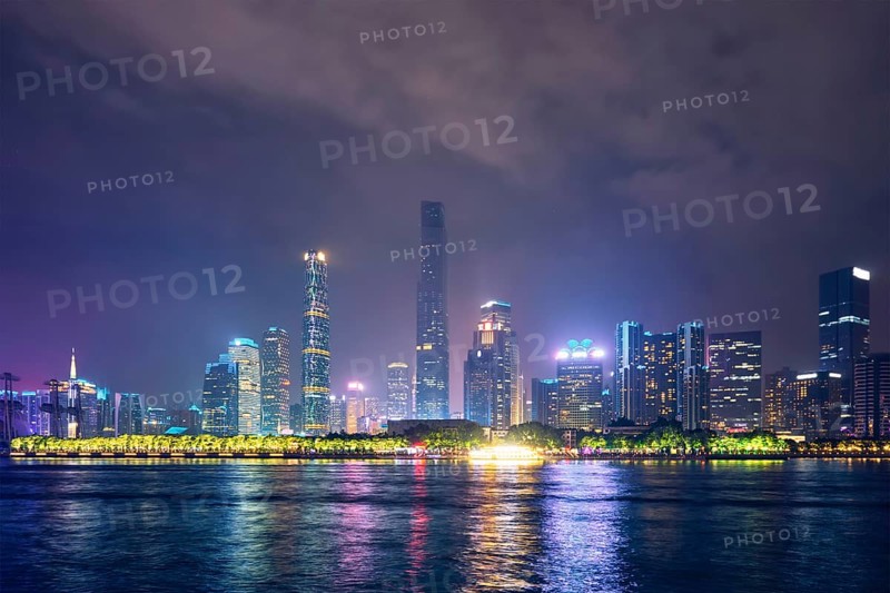 Guangzhou cityscape skyline over the Pearl River illuminated in the evening. Guangzhou