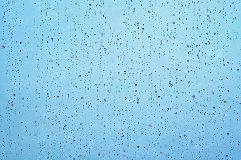 Rain water drops droplets on window glass texture background