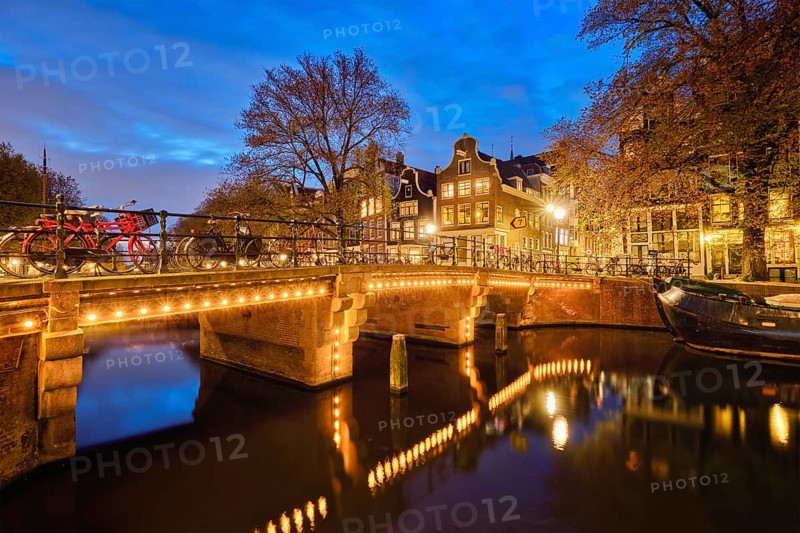 Night view of Amterdam cityscape with canal