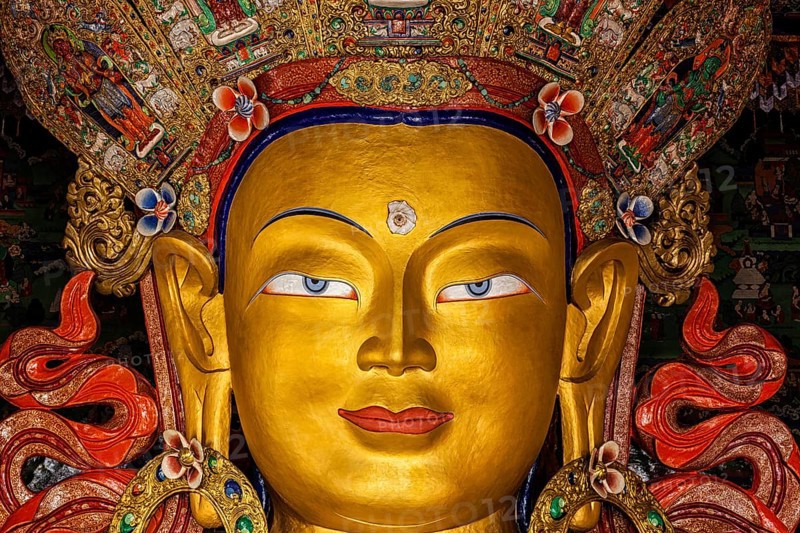 Maitreya Buddha statue face close up in Thiksey Gompa. Ladakh