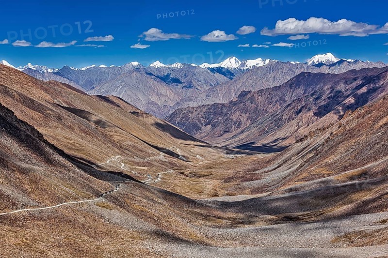 View of Karakorum range and road in valley from Kardung La