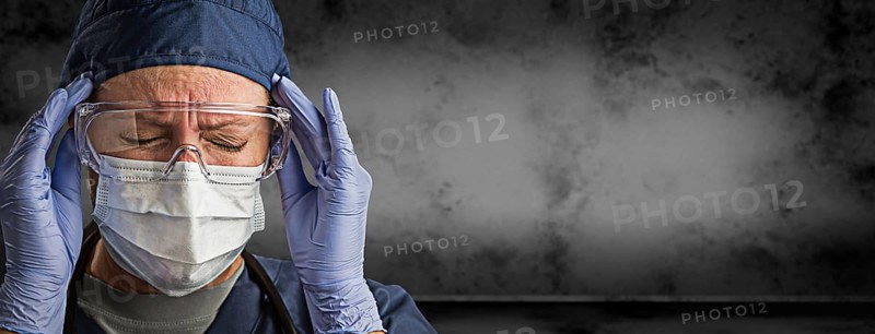 Female doctor or nurse wearing goggles