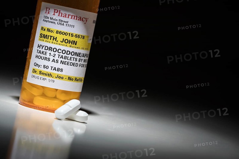 Hydrocodone pills and prescription bottle with non proprietary label. no model release required