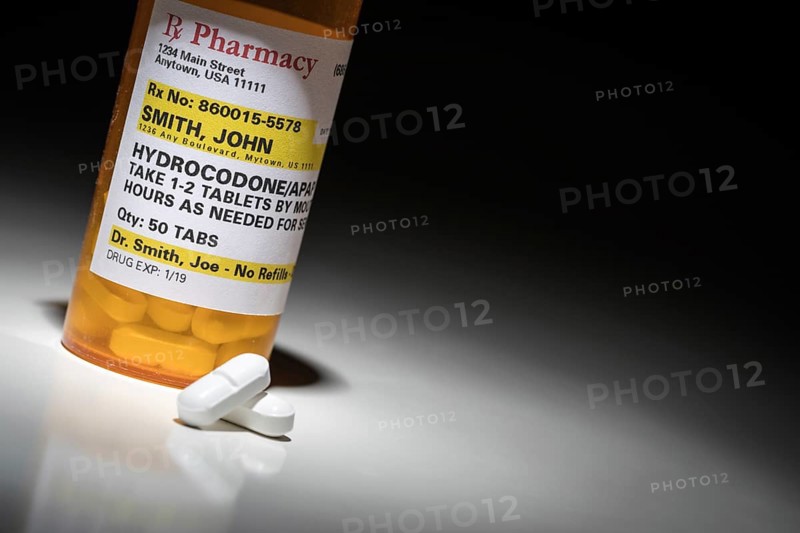 Hydrocodone pills and prescription bottle with non proprietary label. no model release required